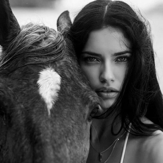 Adriana Lima modeling with a horse