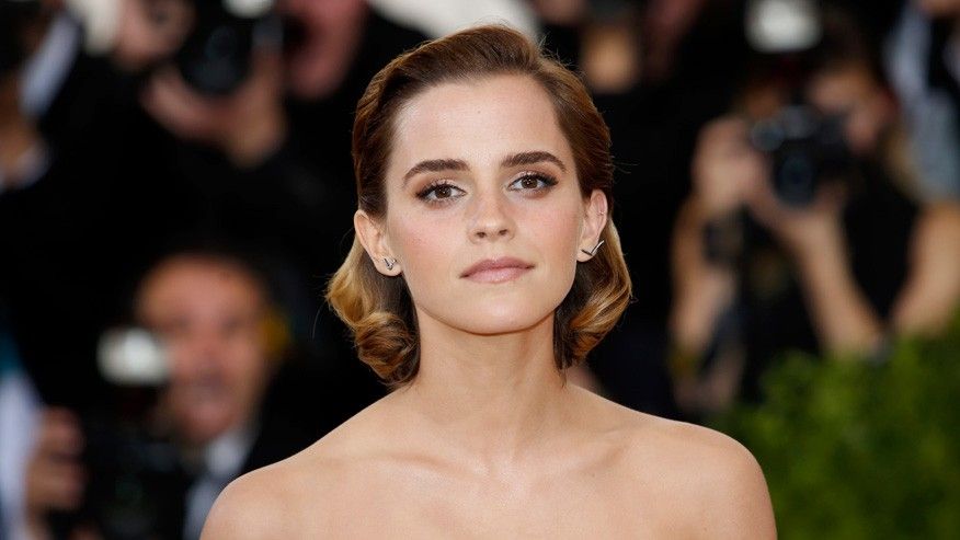 Emma Watson on red carpet with off the shoulder dress on