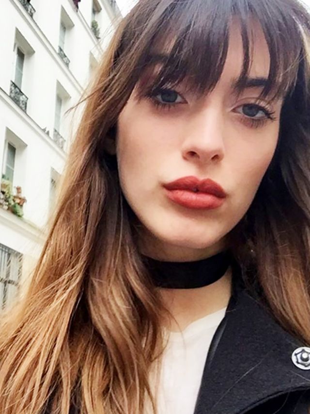 Louise Follain in paris with red lips and a choker