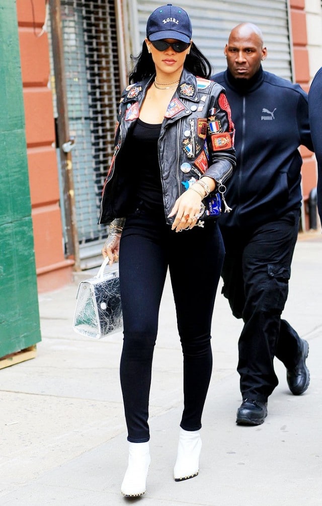 Rihanna in studded white ankle boots and jeans